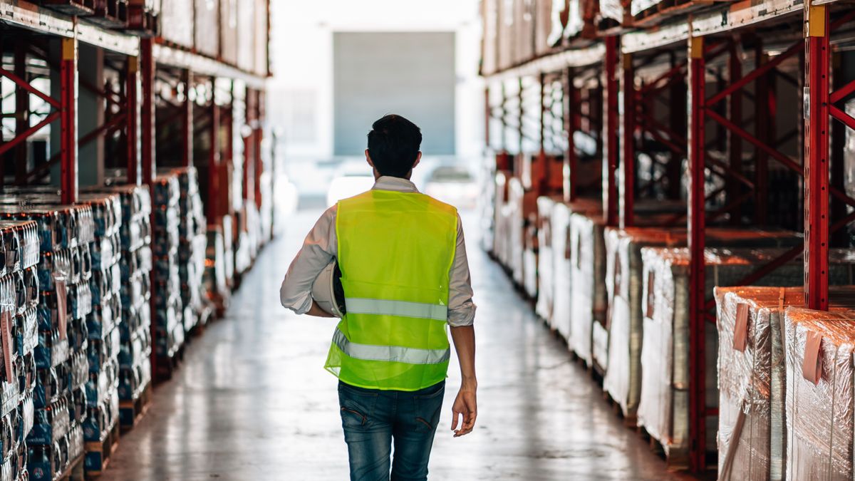 A,Lone,Male,Warehouse,Worker,,Seen,From,Behind,,Walks,Down hazai vállalatok