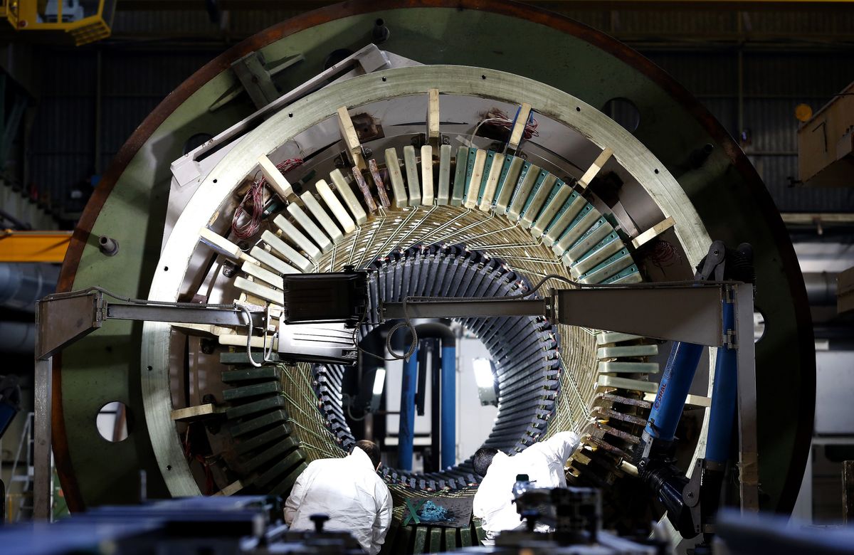Genoa,,Italy,-,January,18,2013:,Employees,Work,On,A Ansaldo gas turbine