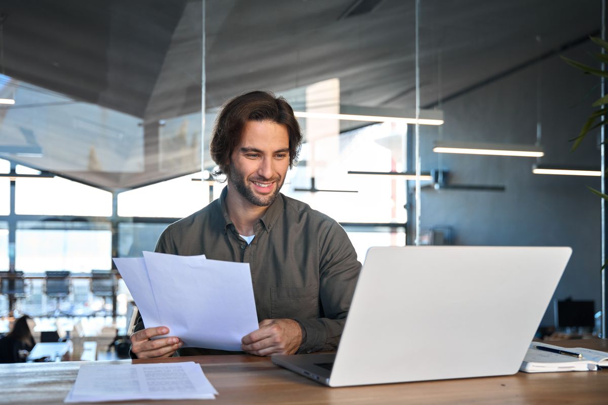 Happy,Busy,Young,Business,Man,Accountant,Reading,File,Report,Documents