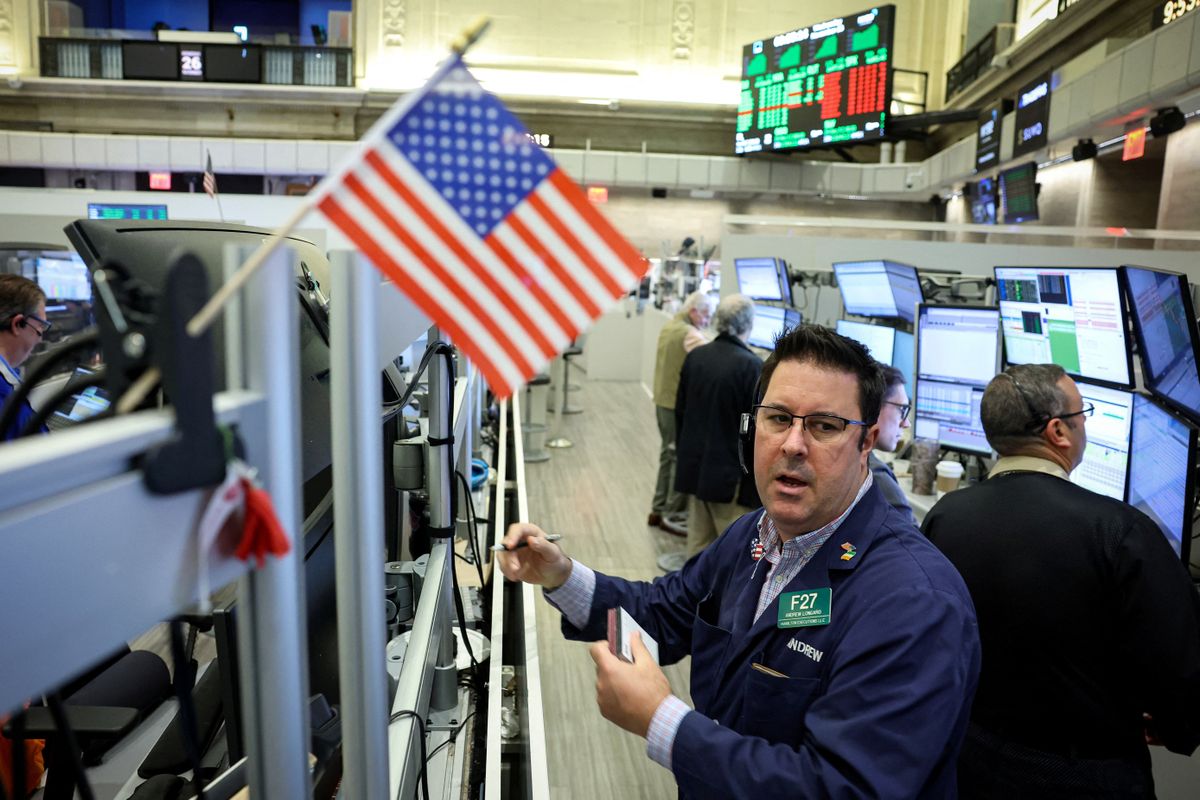 Traders work on the floor of the NYSE in New York