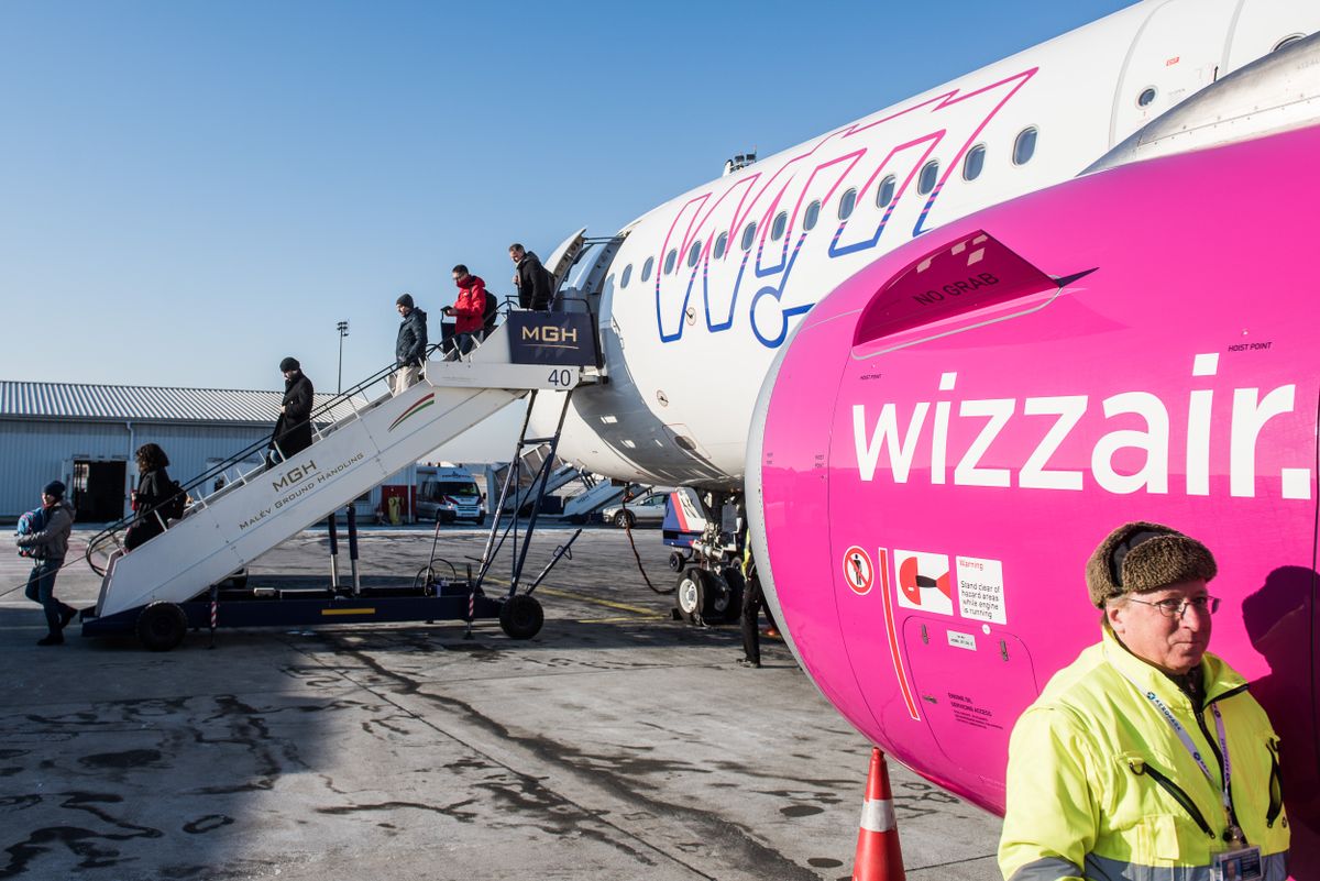 Passangers disembark from a Wizz Air jet in Budapest.
