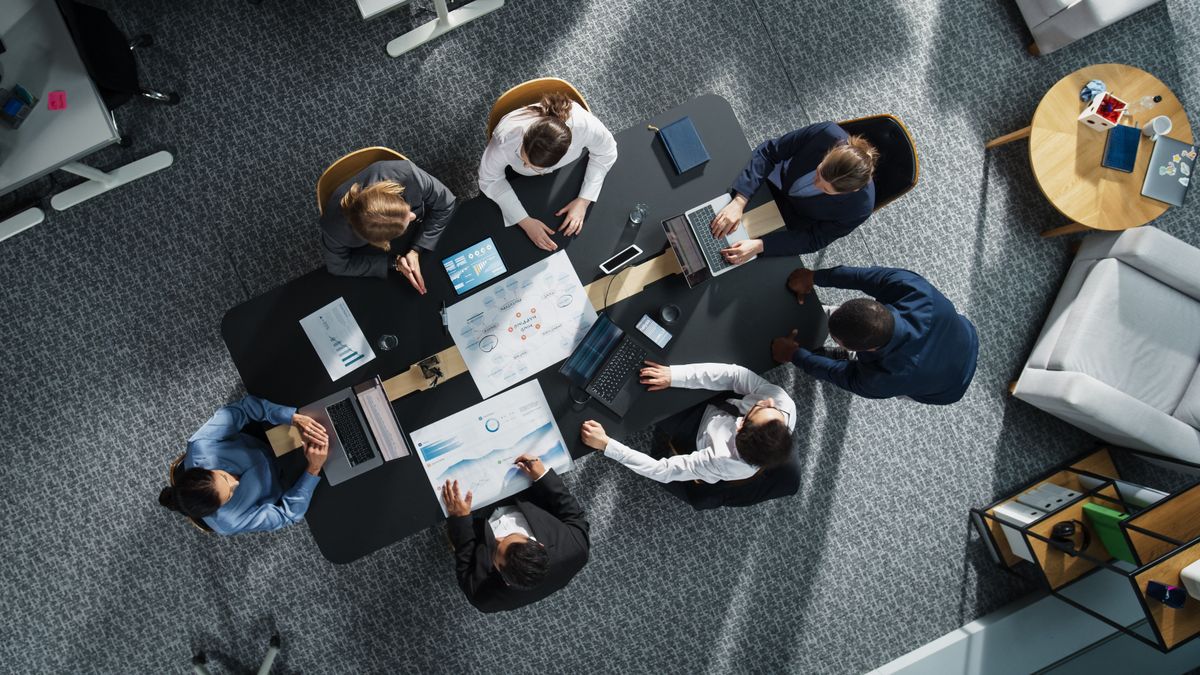 digitalizáció,Diverse,Professionals,Working,On,Business,Statistics,Reports,And,Digital,Plans