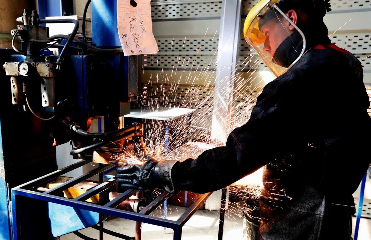 An employee works on the production of&nbsp;traffic&nbsp;signs at a factory of KrasDorZnak in Krasnoyarsk region