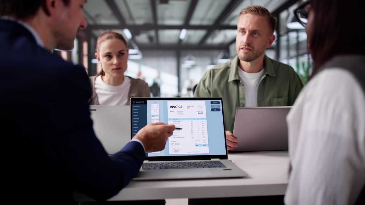 Multiracial,Group,Collaborating,On,Electronic,Invoice,Factoring,Software,Management.