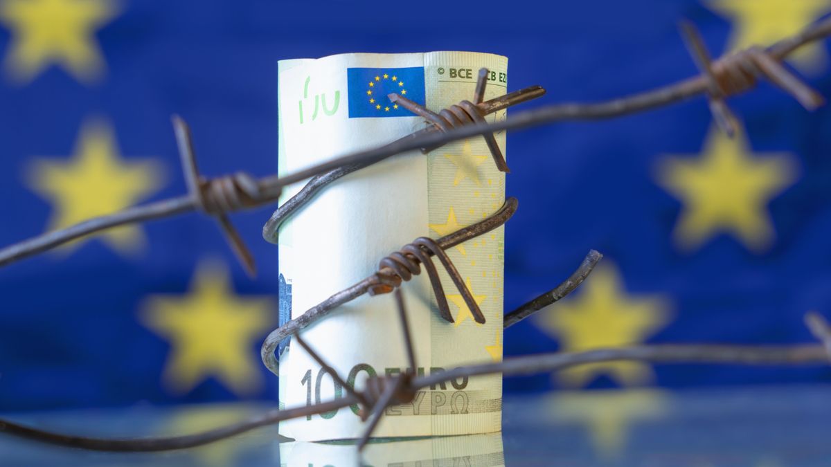 Economic,Warfare,,Sanctions,And,Embargo,Busting,Concept.,Eu,Money,Wrapped safe