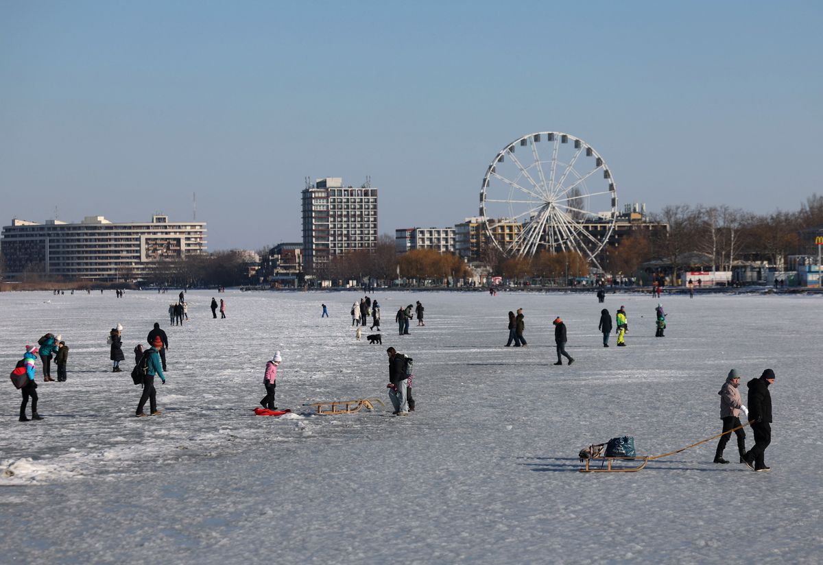 People enjoy the frozen Lake Balaton in Siofok