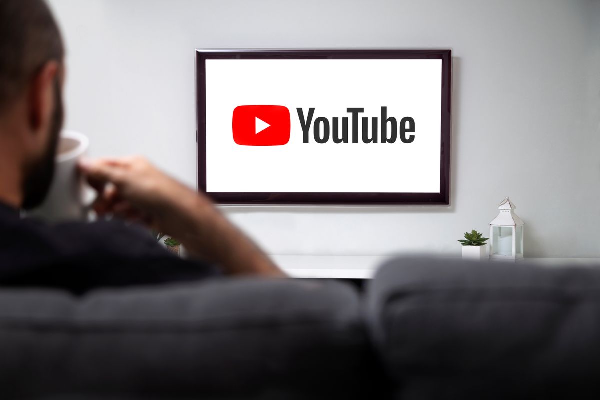 Youtube,On,Tv.,Man,With,A,Mug,And,Watching,A
