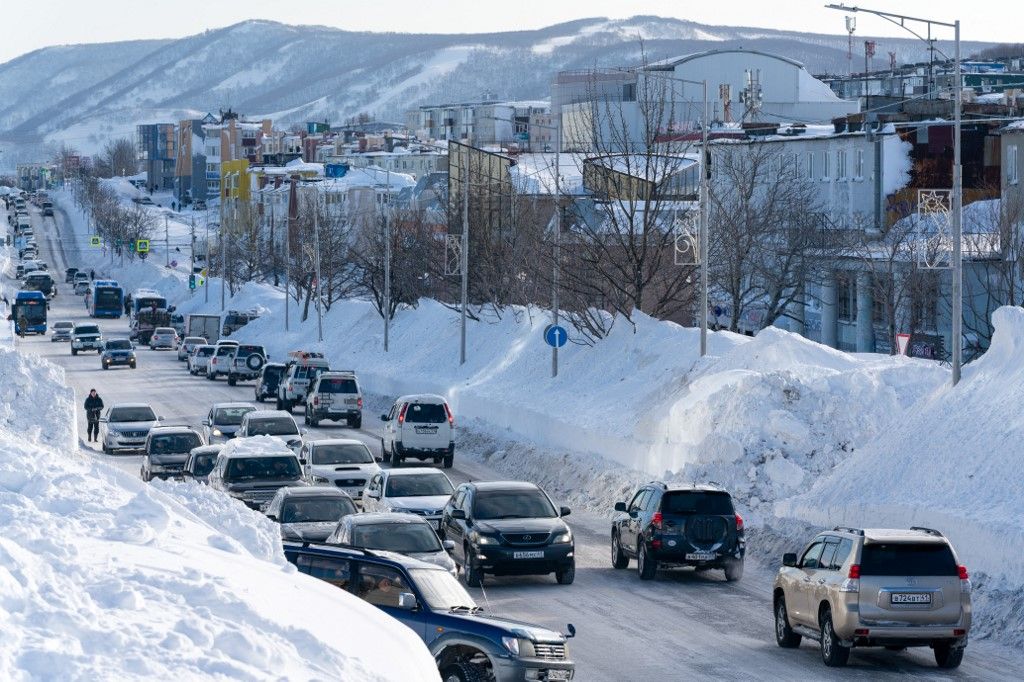 KAMCHATKA, RUSSIA - JANUARY 19: Vehicles move along roads cleared of snow as Kamchatka Peninsula has experienced the heaviest snowfall in the last 30 years in Russia on January 19, 2026. Alexander A. Piragis / Anadolu (Photo by Alexander A. Piragis / Anad
