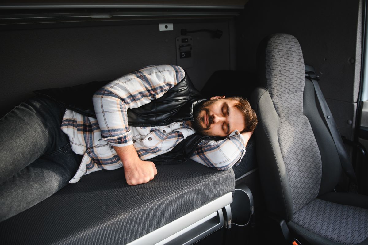 Professional,Truck,Driver,Taking,A,Necessary,Break,,Sleeping,Comfortably,In