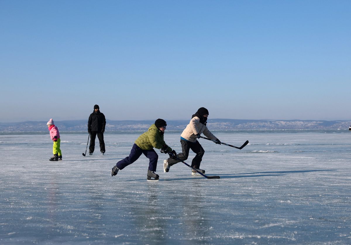 Children skate on the frozen Lake Balaton in Siofok