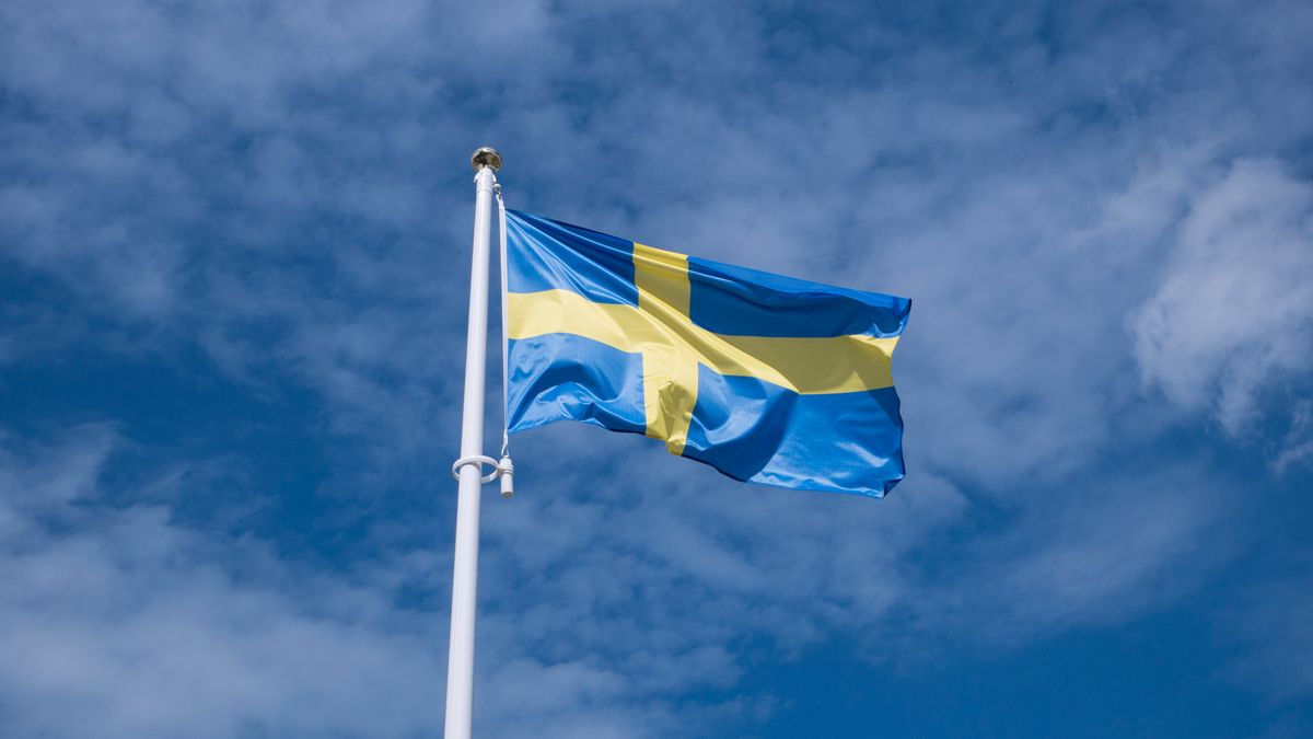 Swedish,Flag,Waving,In,Sunny,Blue,Sky.