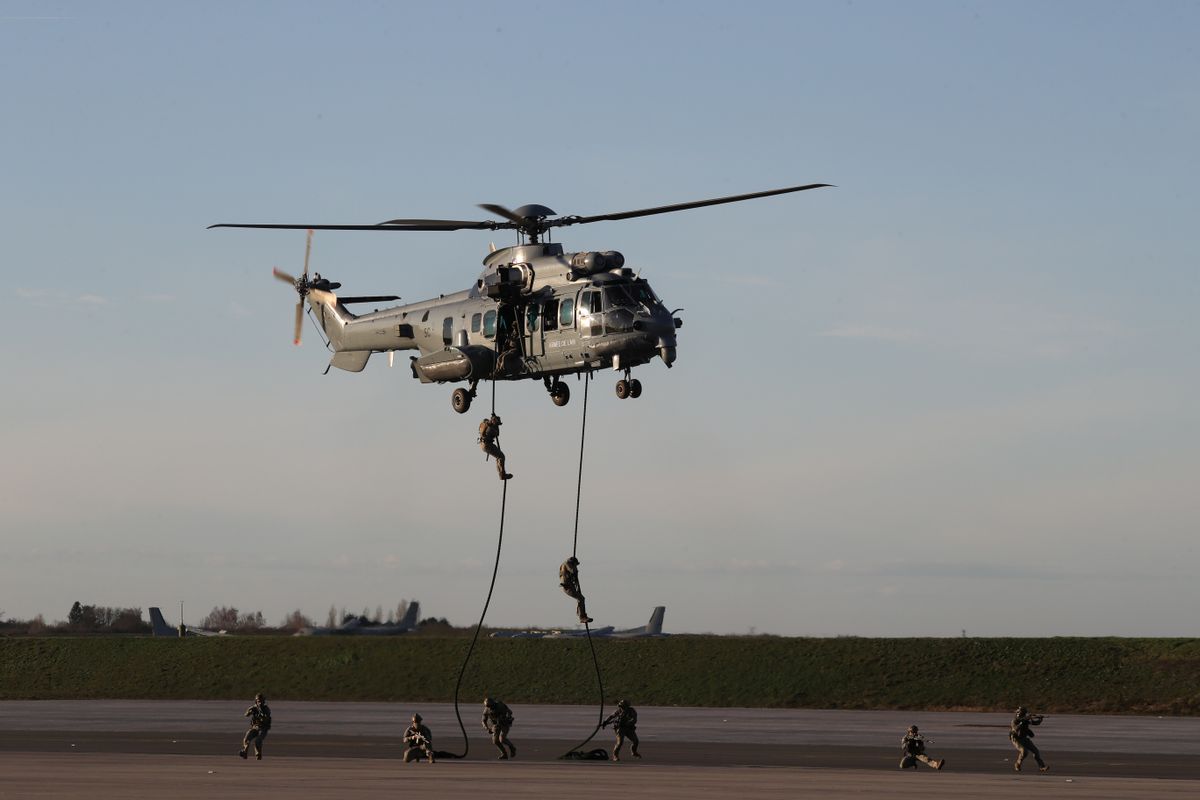 Soldiers of French Air Force special forces perform a demonstration with their Caracal helicopter at the 123 Air Base of Orleans-Bricy near Orleans franciaország 