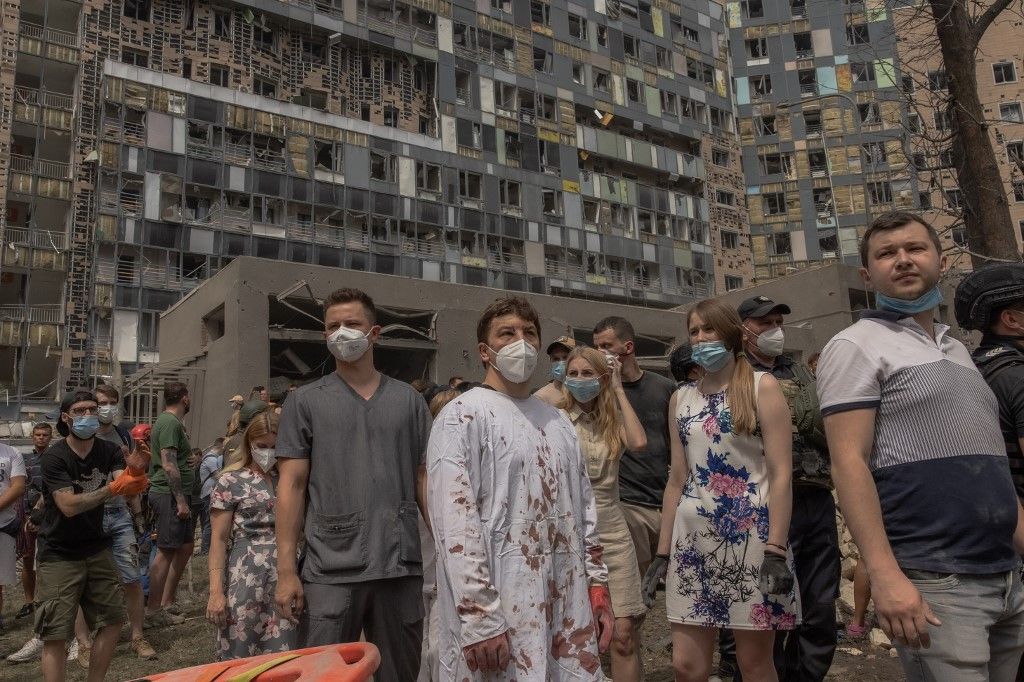 (FILES) Ukrainian doctor Ihor Kolodka (C) stands amid the rubble of the destroyed building of Ohmatdyt Children's Hospital following a Russian missile attack in the Ukrainian capital of Kyiv on July 8, 2024, amid Russian invasion in Ukraine. Russia launch