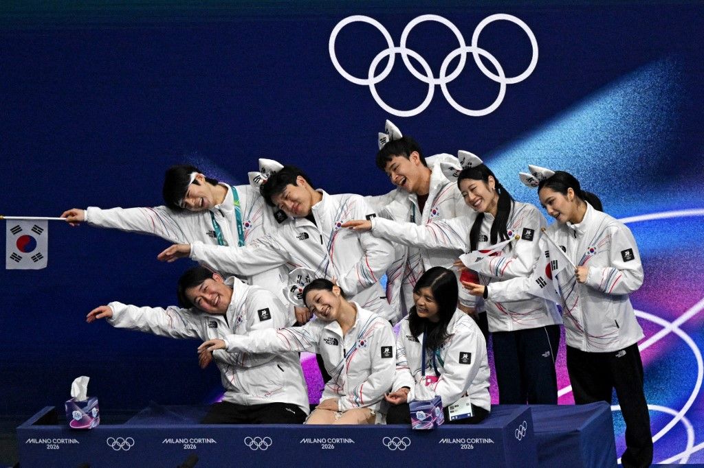South Korea's Shin Jia (C front) poses with her teammates after competing in the figure skating women's single short program team event during the Milano Cortina 2026 Winter Olympic Games at Milano Ice Skating Arena in Milan on February 6, 2026. (Photo by