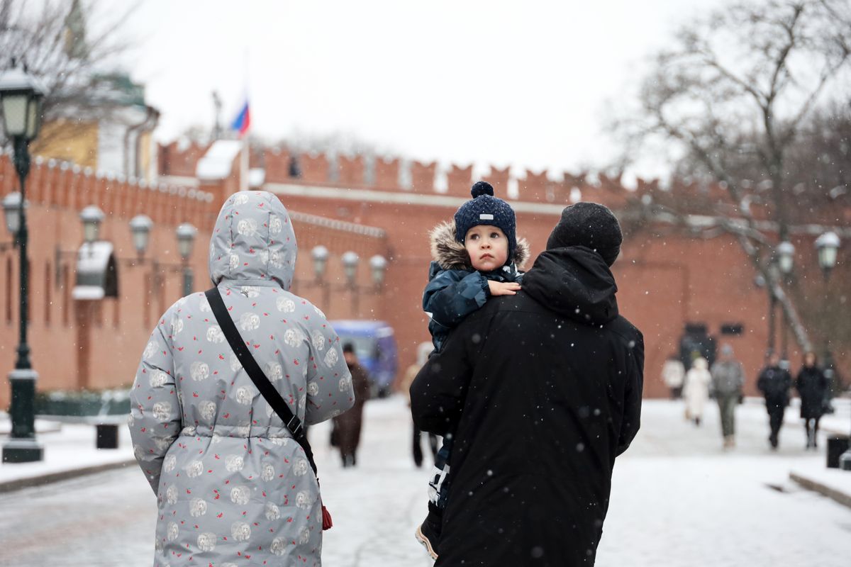 Moscow,,Russia,-,January,14,,2025:,Couple,Walking,With,Child