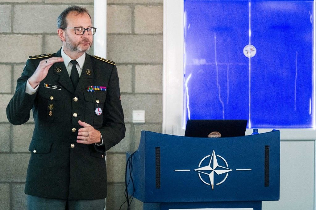 A sorozás bevezetése: ez az a "B" terv, amit úgy terveznek, mintha "A" terv volna – a belga kormány még nem tudja, a belga táboronok már igen és a németekre hivatkozik