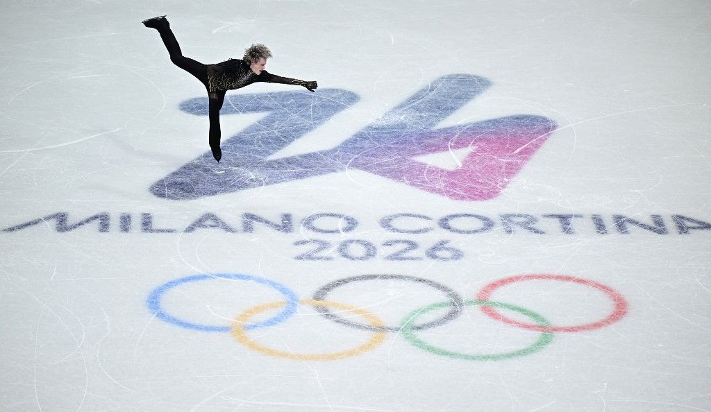 USA's Ilia Malinin compete in the figure skating men's singles free skating team event during the Milano Cortina 2026 Winter Olympic Games at Milano Ice Skating Arena in Milan on February 8, 2026. (Photo by JULIEN DE ROSA / AFP)