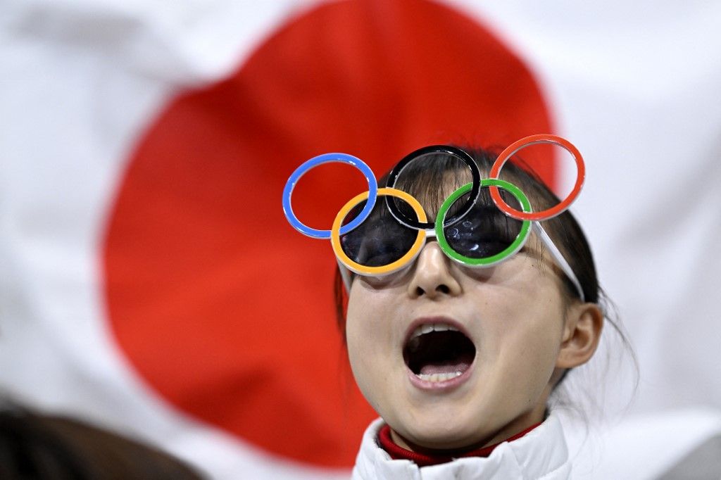 Japan's Kaori Sakamoto reacts in the kiss and cry area after her teammate competed in the figure skating team event men's singles short program during the Milano Cortina 2026 Winter Olympic Games at Milano Ice Skating Arena in Milan on February 7, 2026. (