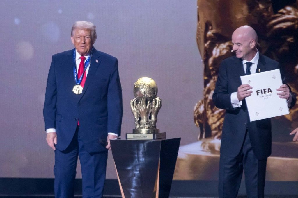 U.S. President Donald Trump receives the FIFA Peace Prize from FIFA President Gianni Infantino at the FIFA World Cup 2026 Official Draw at the John F. Kennedy Center for the Performing Arts
