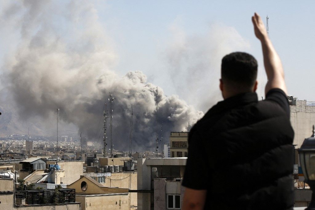 TEHRAN, IRAN - MARCH 01: Plumes of smoke rise over the residential areas of the Iranian capital following airstrikes amid ongoing U.S.–Israel attacks as multiple explosions are heard across the city in Tehran, Iran on March 01, 2026. Fatemeh Bahrami / Ana