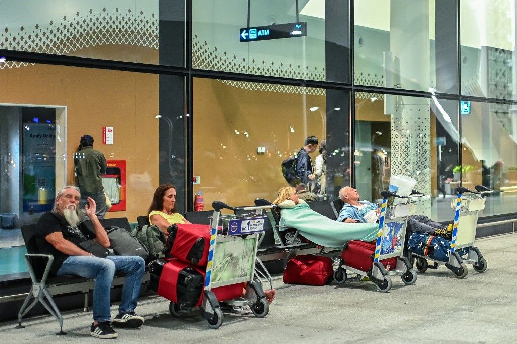 Stranded passengers wait at the Velana International Airport in Male on March 1, 2026 after the cancellation of several flights destined for the Middle East. The biggest disruption to global air transport since the Covid pandemic continued on March 1, wit