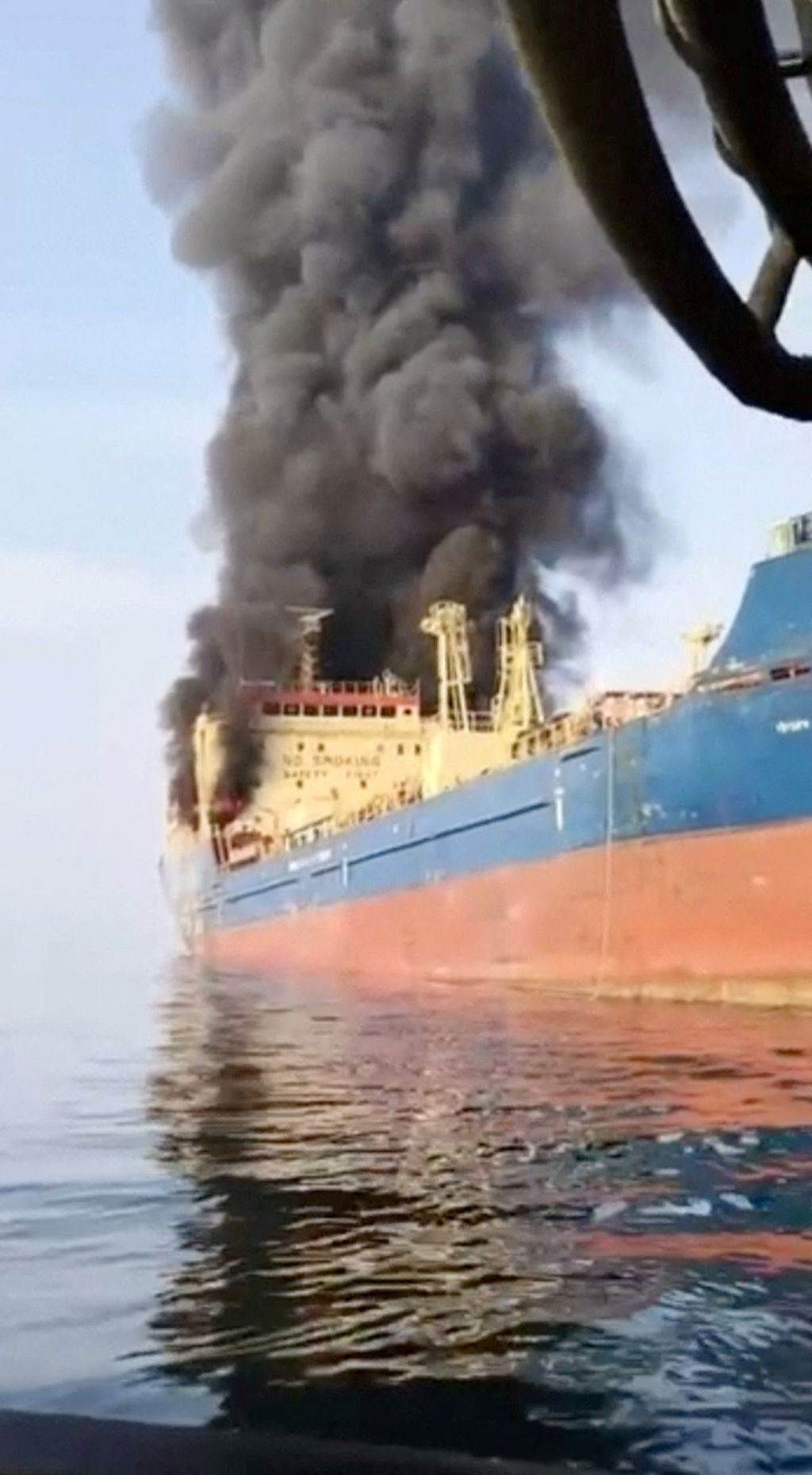 Smoke billows from an oil tanker under U.S. sanctions, that was hit off Oman's Musandam peninsula, in this screen grab from a video obtained by REUTERS on March 1, 2026.
THIS IMAGE HAS BEEN SUPPLIED BY A THIRD PARTY
VERIFICATION
Identity of the vessel co