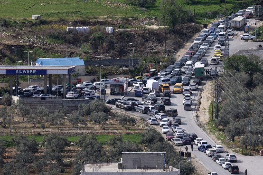 People rush to fill their tanks at a petrol station in Nablus, in the occupied West Bank on February 28, 2026, after Israel and the US launched attacks on Iran. Israeli Prime Minister Benjamin Netanyahu said Iran must not be allowed to gain nuclear arms a