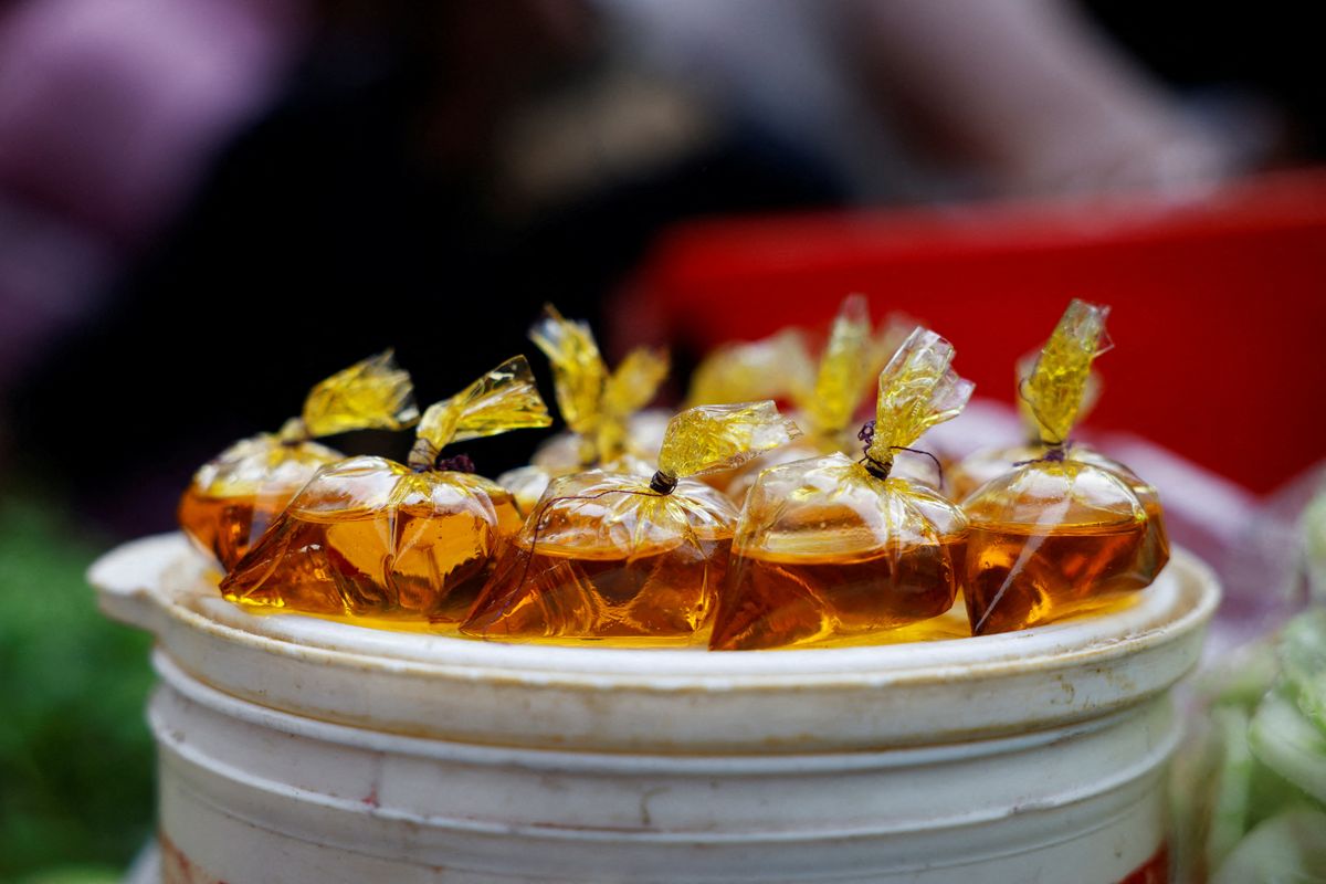 Edible oil is seen in tiny polythene packets, on the first day of Ramadan, in Dhaka