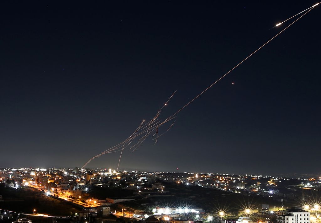 HEBRON, WEST BANK - MARCH 1: Missiles launched from Iran are seen in the skies over the city of Hebron, West Bank, on March 1, 2026. The strikes continue as part of Iran's ongoing retaliation against U.S. and Israeli attacks. Some of the missiles were des