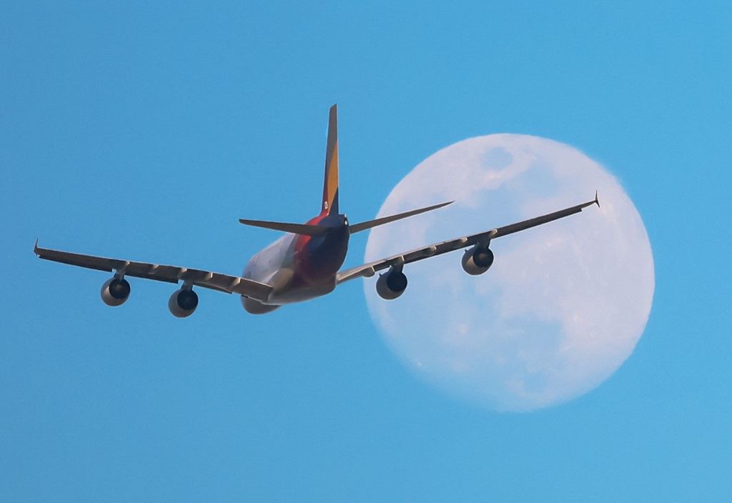 An Asiana Airlines Airbus A380 flies over Barcelona after a go-around