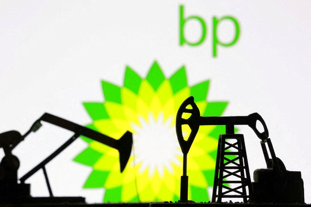 FILE PHOTO: Illustration shows 3D printed oil pump jacks and British Petroleum (BP) logo