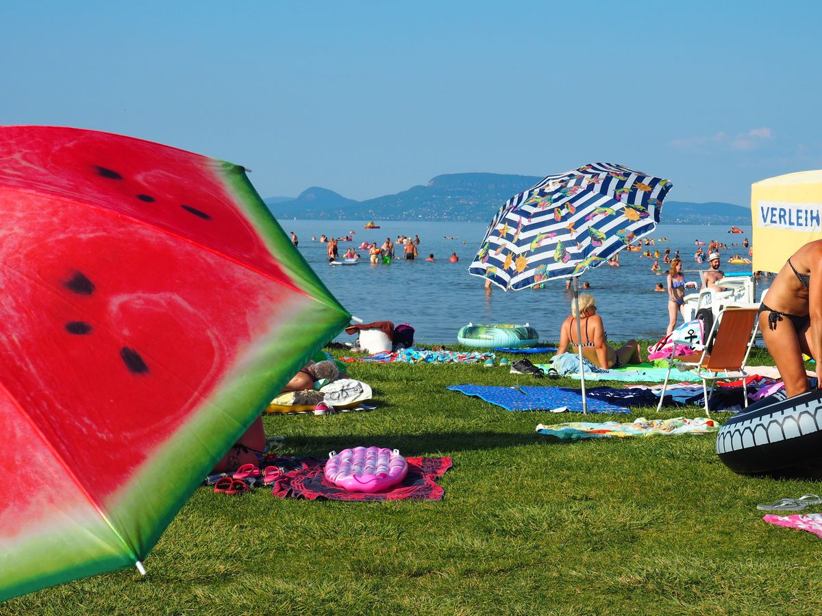 Balaton Balatonmáriafürd?,,Hungary,-,July,29,,2020:,Colorful,Umbrellas,,Sunbathing,And