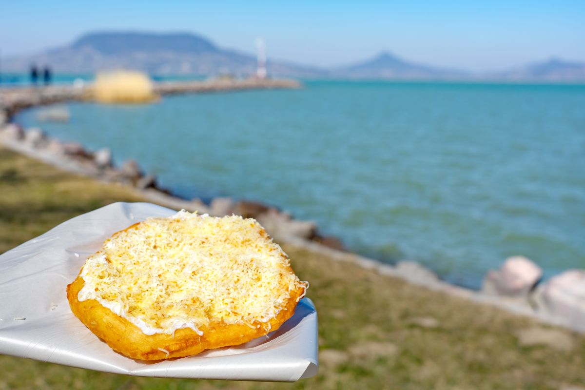 Typical,Hungarian,Lake,Balaton,Food,Langos,With,Lake,Background,In Balaton vendéglátás szakács turizmus lángos