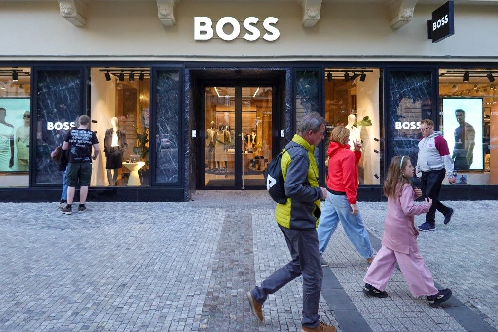 Hugo Boss Storefront With Passersby In Prague