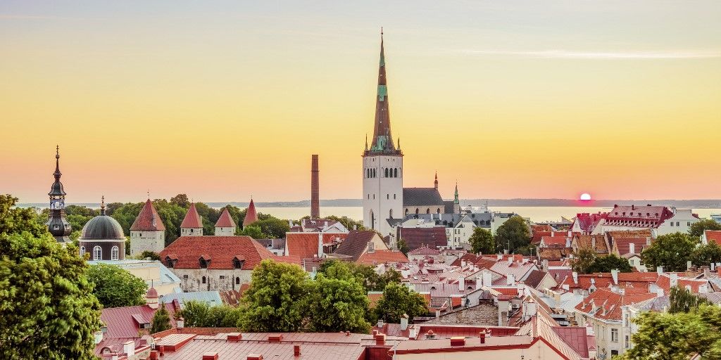 OTP View over the Old Town towards St Olaf's Church at sunrise, Tallinn, Estonia