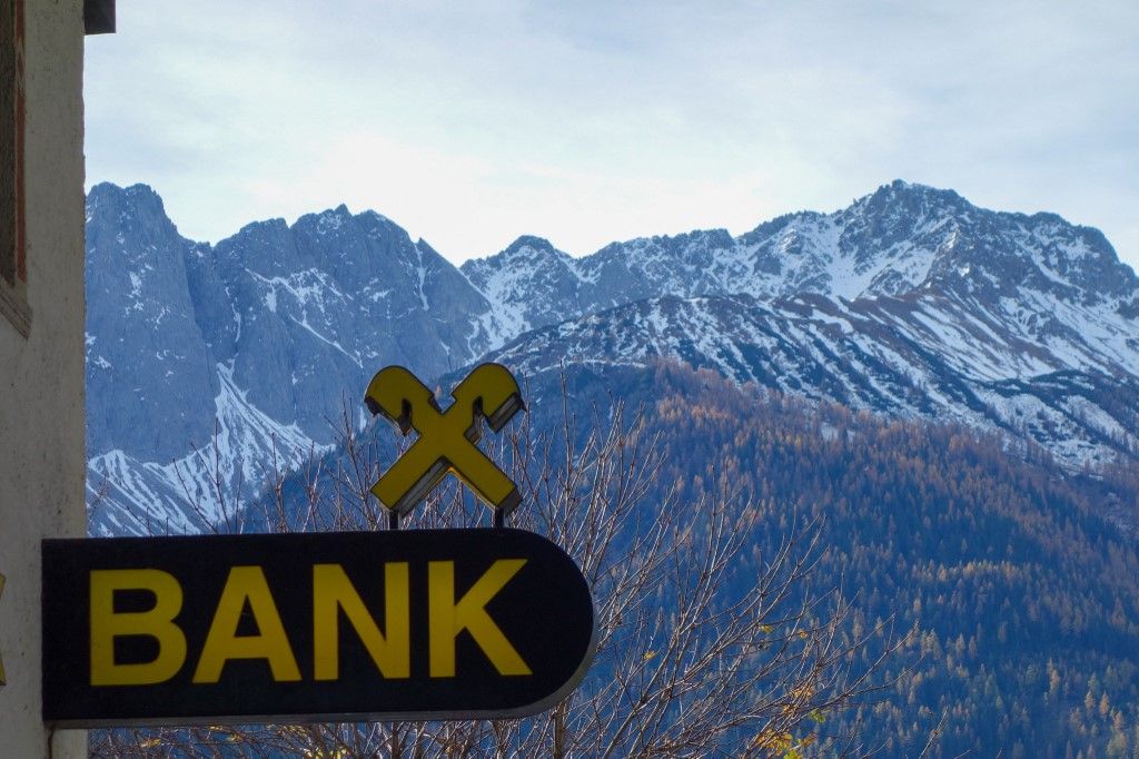 OTP Raiffeisenbank Branch Against Snow-Capped Tyrolean Alps