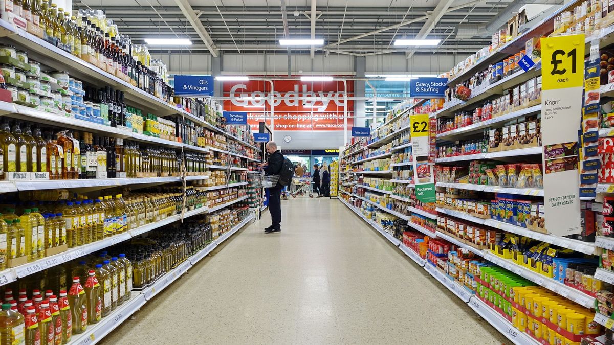 Shoppers,Browse,An,Aisle,In,A,Tesco,Supermarket,On,April