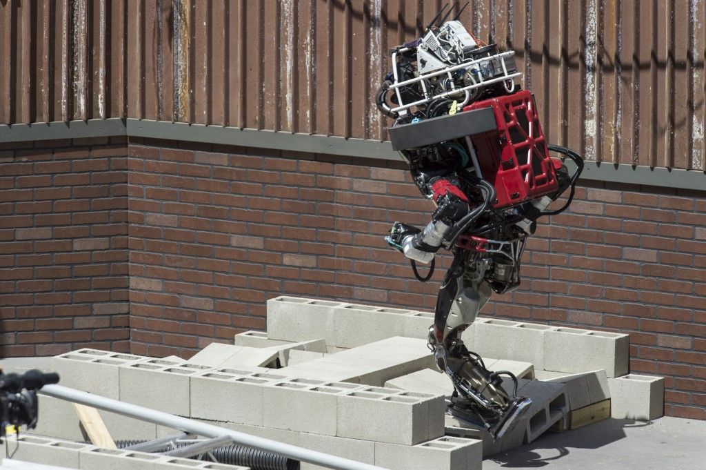 A military robot navigates a debris field